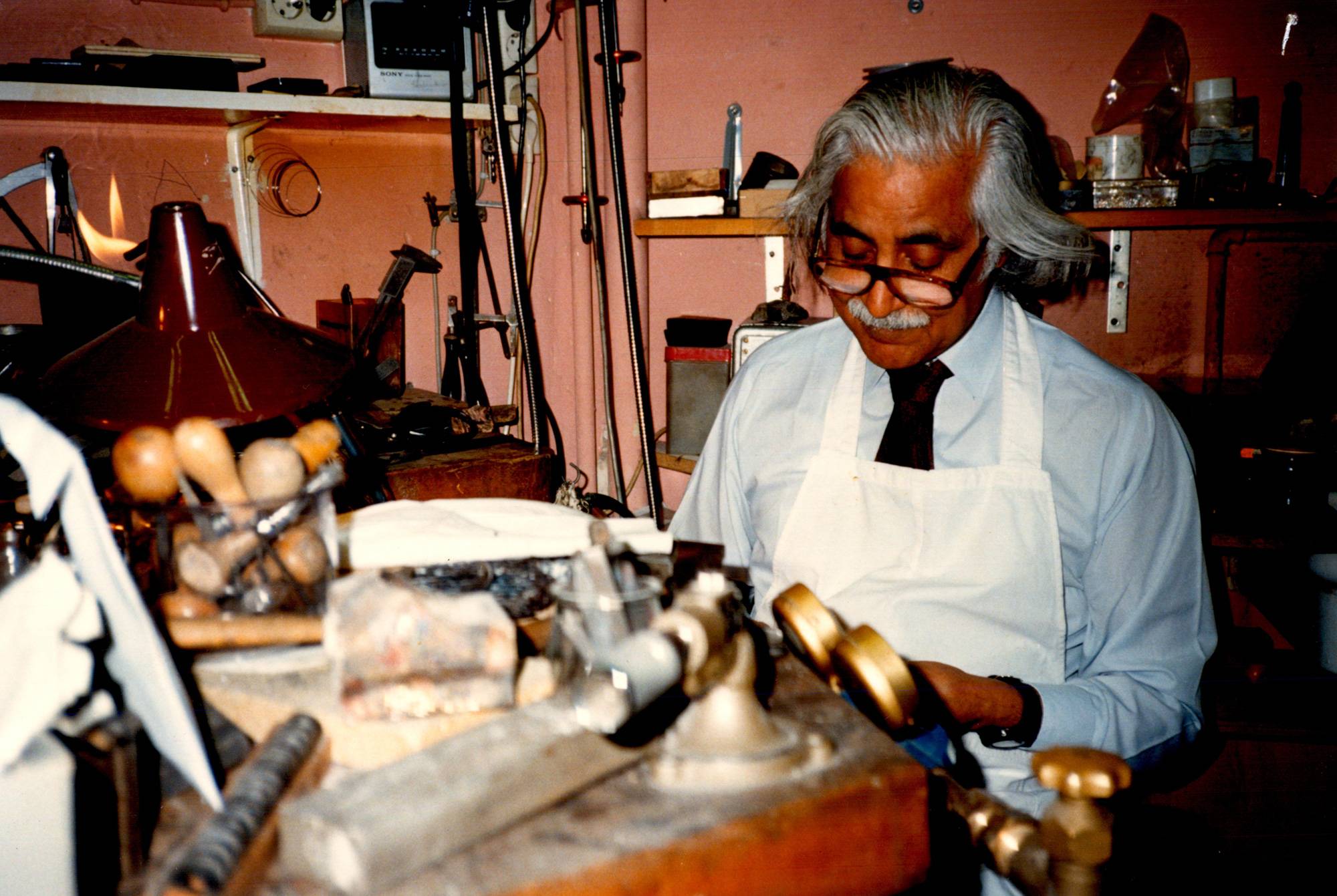 Artist working on Gold Sculpture